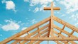 © Flowaiart - Wooden Cross Atop Church Under Construction Against Blue Sky