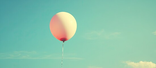 Poster - Pink and white balloon against a blue sky with copyspace vintage filter