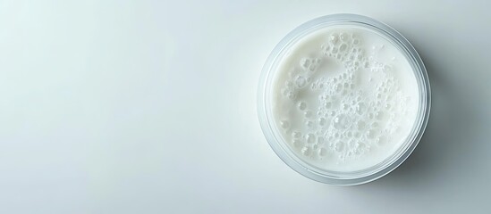 Poster - Shower cream in a petri dish with a plastic lid on a white lab table Chemical component for cosmetic and toiletry products Top View. with copy space image. Place for adding text or design