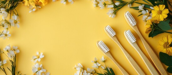 Aufkleber - Four bamboo toothbrushes on a yellow backdrop surrounded by a floral frame Eco friendly. with copy space image. Place for adding text or design
