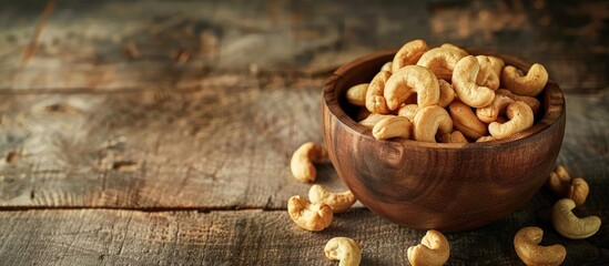 Aufkleber - Numerous cashews in the vintage wooden bowl Dried nuts theme. with copy space image. Place for adding text or design