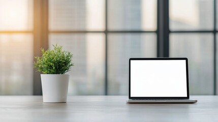 Poster - Open laptop with blank screen showing bright light in modern office with plant