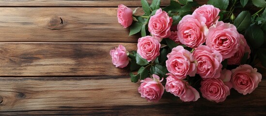 Aufkleber - Bouquet of garden pink roses on a wooden table Top view with copyspace