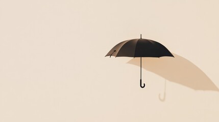 Leinwandbilder - Black umbrella floating in the air with its shadow projected on a beige background, creating a surreal and minimalist composition with copy space
