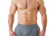 © Sergio - Muscular male torso showcasing defined abs and strong physique against a plain background