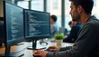 © miss irine - Focused programmer works at computer in modern office. Developer codes on laptop. Team collaborates on project. Person engrossed in coding. Modern tech office environment. Concentrated work. Business