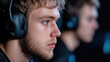 © Julia Jones - National Video Game Day Young caucasian male gamer focused on esports with headphones