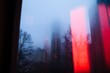 © Moon - A foggy cityscape viewed through the window of a moving train, symbolizing the overwhelming and disorienting pace of life and the difficulty of navigating emotional challenges.