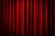 © mamo studios - Closed maroon red curtain of stage with spotlight before show. Art performance background.