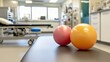 © Iona - Bright physiotherapy center featuring colorful exercise balls on a clean, inviting table, creating an atmosphere of health and wellness.