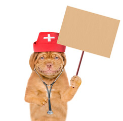 Poster - Mastiff puppy dressed like a doctor with medical cap and  stethoscope  holds blank placard on wooden stick. Isolated on white background