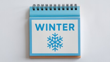 Poster - A blue desk calendar showing the word WINTER and a snowflake.