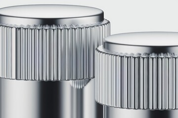 Aufkleber - Close-up of two metallic cylindrical objects with ribbed tops, showcasing a sleek and modern design.