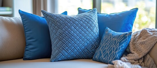 Poster - Elegant blue decorative pillows with detailed stitching ideal for stylish home decor and interior enhancements