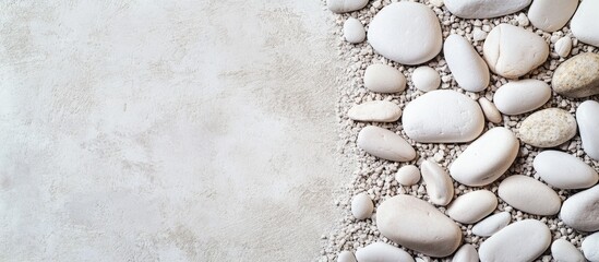 Poster - White pebbles and gravel top view with blank space for text creating a natural and serene background for design projects