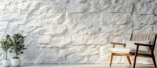 Poster - Textured white stone wall in modern interior setting ideal for home office or hotel decor featuring natural elements and contemporary furniture