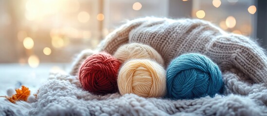 Poster - Cozy winter scene with colorful yarn balls and soft textures illuminated by warm natural light in a home setting