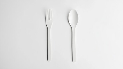 Aufkleber - Minimalist White Cutlery Set Fork and Spoon Isolated on White Background Ideal for Restaurant or Food Service Design Concepts