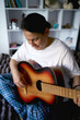 © Victoria Antre - a senior woman learns to play the guitar with online lessons
