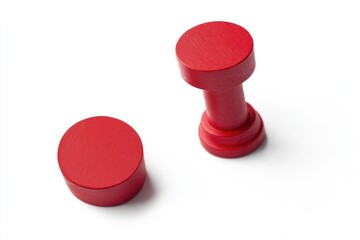 Poster - A pair of red knobs sit atop a white surface, waiting for use