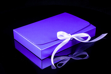 Wall Mural - Man gift concept. gift box with luxury bow on dark background. Horizontal with copy space.