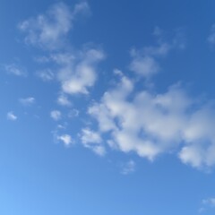 Blue sky with scattered cumulus clouds. (1)