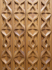 Poster - A Wooden Panel Features A Distinctive Oak Wood Grain Texture With An Intricate, Repeating Pattern Of Interlocking Shapes. 00002