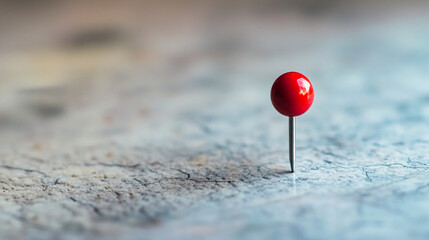 Poster - Red map pin on a textured surface with soft focus background