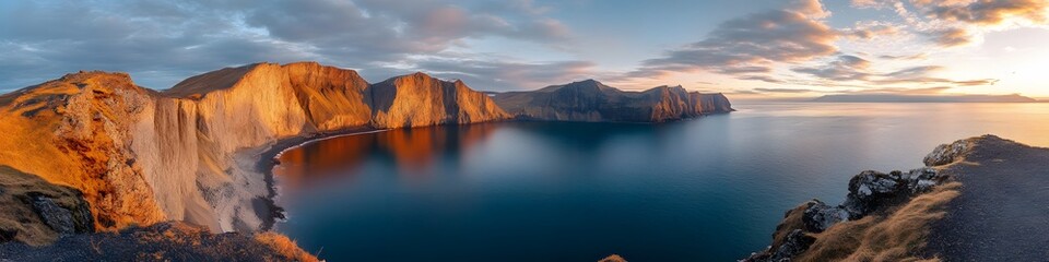 Poster - Panoramic view of Lake Srvagsvatn perched dramatically above the ocean, with vibrant cliffs glowing under golden sunlight, in 4K resolution
