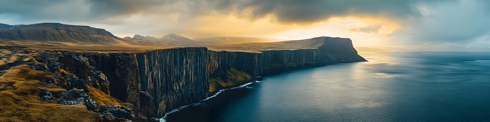 Poster - Panoramic view of Lake Srvagsvatn perched dramatically above the ocean, with vibrant cliffs glowing under golden sunlight, in 4K resolution