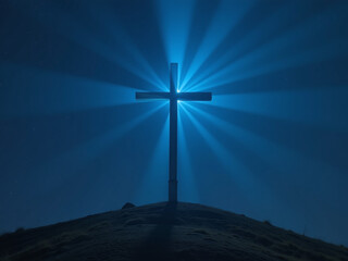 Wall Mural - a majestic christian cross illuminated by a soft blue light ray in the darkness of a quiet night sky