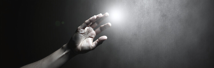 Aufkleber - A Hand Reaches For A Soft Focus Light Source Against A Textured Black And White Background With Ample Copy Space Available. 00003