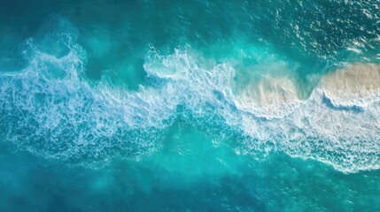 Poster - Aerial view of turquoise ocean waves with soft sand shoreline creating a serene abstract background for text or design projects