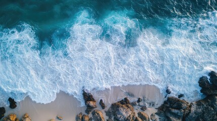 Poster - Aerial view of turquoise waves crashing on rocky shoreline with sandy beach and ample copyspace for creative text placement