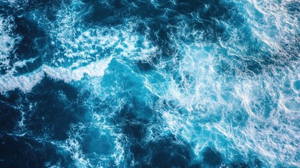 Poster - aerial view of mesmerizing blue ocean waves creating a tranquil background ideal for text placement 