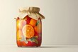 © Amal - A glass jar filled with juicy strawberries, oranges, and mandarins, preserved in a sweet syrup.