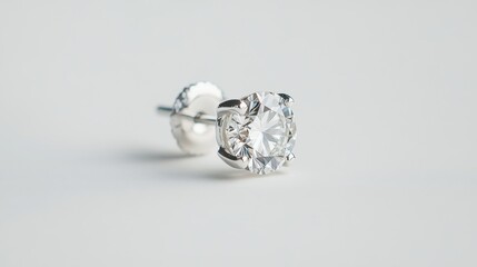 Poster - A sparkling diamond earring stud floating elegantly against a plain white background.