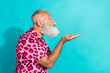 © deagreez - Profile portrait of funky aged man send air kiss empty space wear leopard print costume isolated on turquoise color background