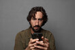 © kues1 - young bearded man using a smartphone