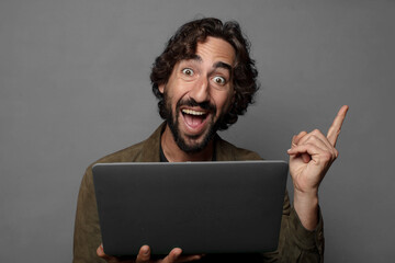 young bearded man using a laptop