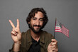 © kues1 - young bearded man with an usa flag