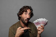 © kues1 - young bearded man with bank notes bills