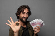 © kues1 - young bearded man with bank notes bills