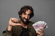 © kues1 - young bearded man with bank notes bills