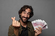 © kues1 - young bearded man with bank notes bills
