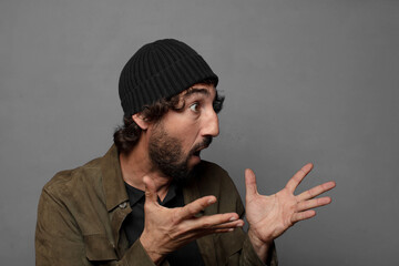 Wall Mural - young bearded man wearing hat