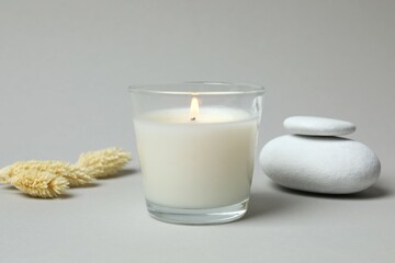 Wall Mural - Aromatic candle on gray background 