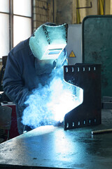Poster - Crafting metal sparks in a busy workshop during daylight hours