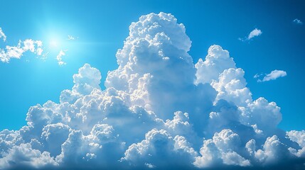 Wall Mural - bright sun shining through fluffy cumulus clouds in a vivid blue sky.