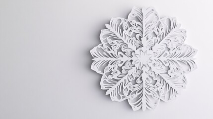 Aufkleber - A delicate paper cut snowflake on a white background